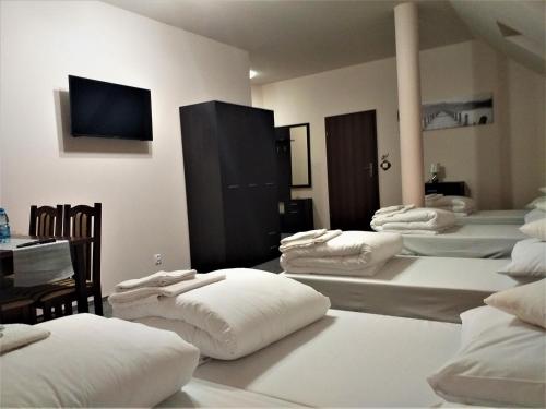 Postel nebo postele na pokoji v ubytování Sum Restauracja & Hotel