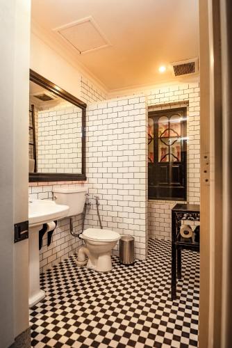 a bathroom with a toilet and a sink at Cheong Fatt Tze - The Blue Mansion in George Town