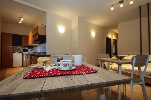 a table with a plate of food on top of it at AceroRosso B&B in Salerno