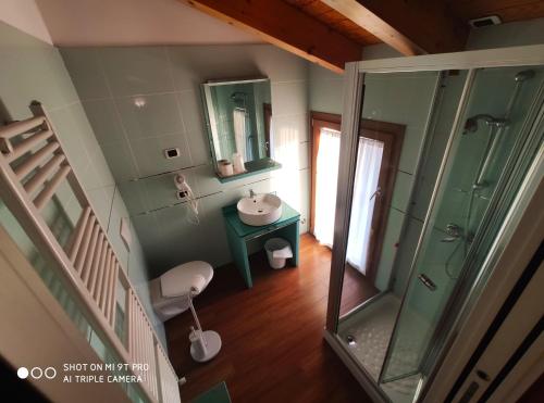 an overhead view of a bathroom with a sink and a shower at Azzano Holidays B&B in Mezzegra