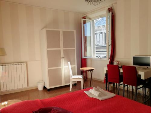 a bedroom with a bed and a table and chairs at Duomo View in Florence