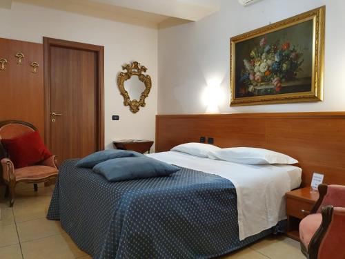 Katil atau katil-katil dalam bilik di Hotel San Giorgio