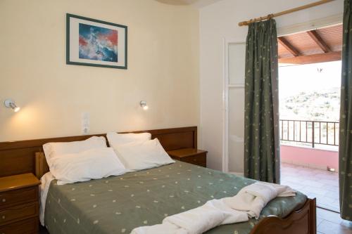 Postel nebo postele na pokoji v ubytování Moros Apartments