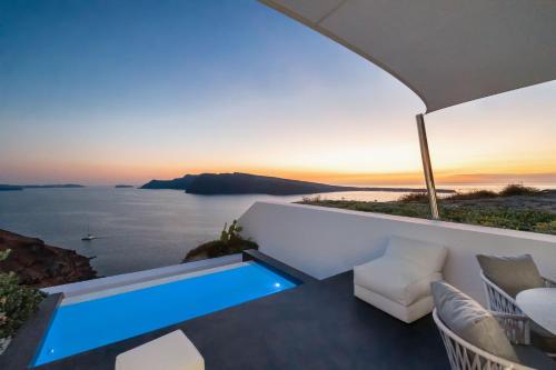 a view of the ocean from a villa with a swimming pool at Marizan Caves & Villas in Oia