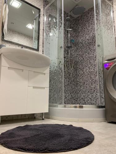 a bathroom with a sink and a shower at Brand new comfortable apartments in Sevan city in Sevan