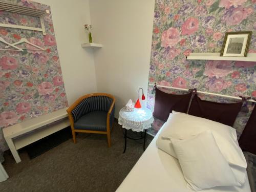 Ένα ή περισσότερα κρεβάτια σε δωμάτιο στο Kolorowa Guest Rooms