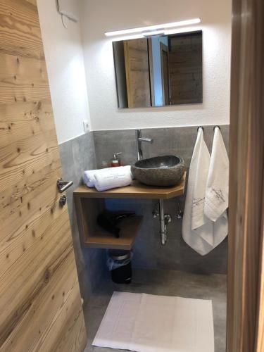 a bathroom with a sink and a mirror at Schwarzenbergerhof in Reith im Alpbachtal