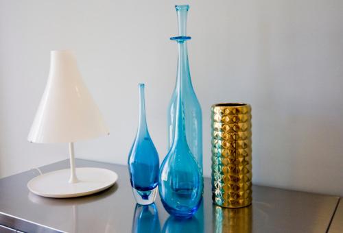 two blue vases and a lamp on a table at BYPILLOW Villa Lorena Adults Recommended in Málaga