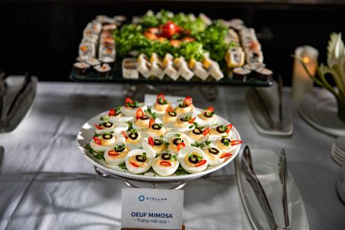 a plate of sushi on a table with a plate of food at Stellar of the Seas Cruise in Ha Long