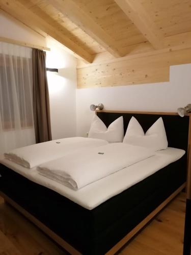 Postel nebo postele na pokoji v ubytování Studler Hofchalets