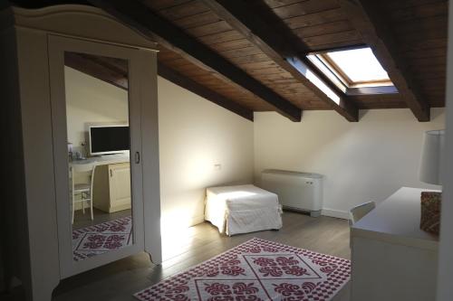 a room with a bedroom with a bed and a desk at Inghirios Wellness Country Resort in Santa Maria la Palma