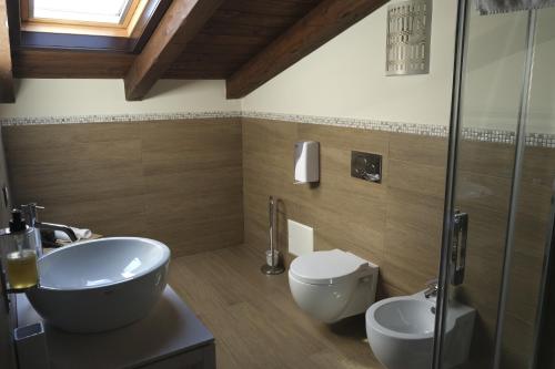 a bathroom with a sink and a toilet at Inghirios Wellness Country Resort in Santa Maria la Palma