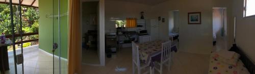 a view of a living room and a kitchen at Casa Canal Barra da Lagoa in Florianópolis