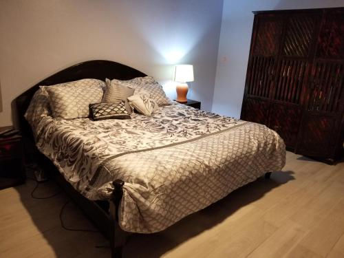 a bedroom with a large bed with pillows on it at Nanny Estates Cabarete kiters Condo C-6 in Cabarete