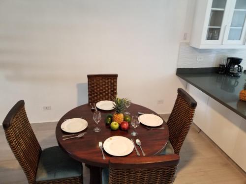 a wooden table with fruit on it in a kitchen at Nanny Estates Cabarete kiters Condo C-6 in Cabarete