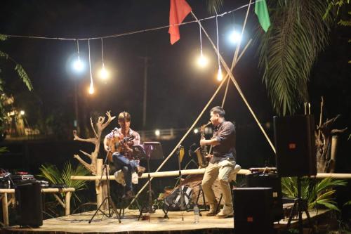 a group of people on a stage at night at KRABI BAMBOO KINGDOM at AOLUEK PARADISE in Ao Luk