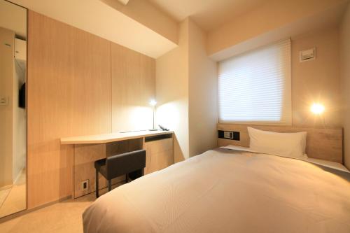 Cama o camas de una habitación en S-peria Inn Nihombashi Hakozaki