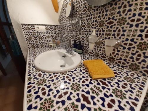 a bathroom with a sink and a counter top at Cuevas Galera - Cuevas de la Luz in Galera