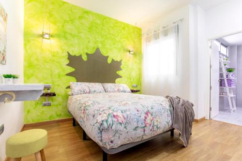 Posteľ alebo postele v izbe v ubytovaní Apartamentos Momas La Casa De Mamá