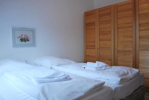 Postel nebo postele na pokoji v ubytování Haus Heidehof Whg. 17