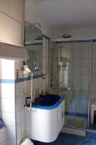 a bathroom with a sink and a shower at B&B Milu' in Crotone