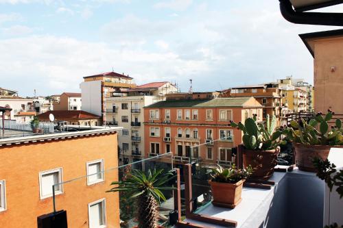 a view of a city from a balcony with plants at B&B Milu' in Crotone