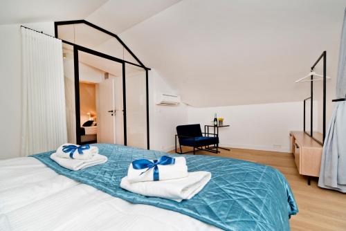 Katil atau katil-katil dalam bilik di BlueApart Apartamenty Na Plaży Jastarnia