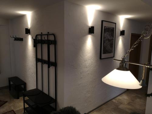 a room with a light on a white wall at Jonas Apartment in Winterberg