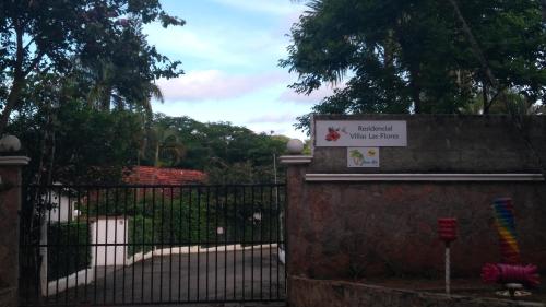 a gate with a sign in front of a fence at Casa Giò in Las Terrenas
