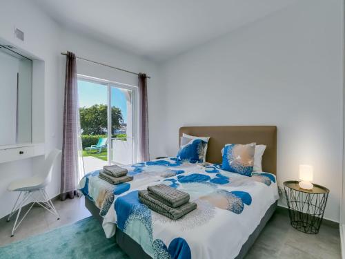 Tempat tidur dalam kamar di Luxury 3 Bedroom Apartment, Albufeira Resort