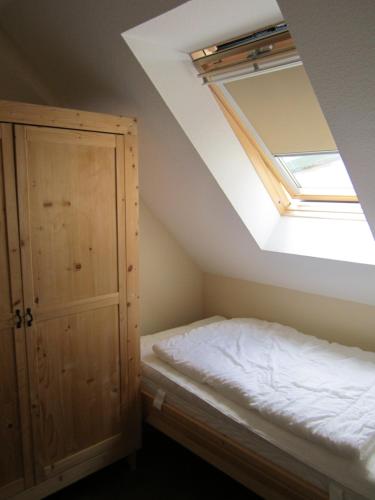 Postel nebo postele na pokoji v ubytování Ferienhaus Dat Fischerhus