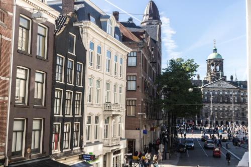 a city street filled with lots of tall buildings at Hotel Doria in Amsterdam