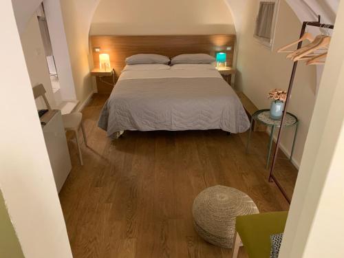 Ένα ή περισσότερα κρεβάτια σε δωμάτιο στο VIA DANTE LUXURY