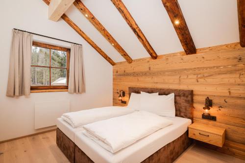 Ein Bett oder Betten in einem Zimmer der Unterkunft Almdorf Omlach, Fanningberg