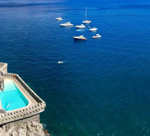 an aerial view of boats in the water at Villa Scarpariello Relais in Ravello