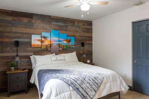 a bedroom with a bed and a brick wall at Casa Madeira @ the heart of Miami Design District in Miami