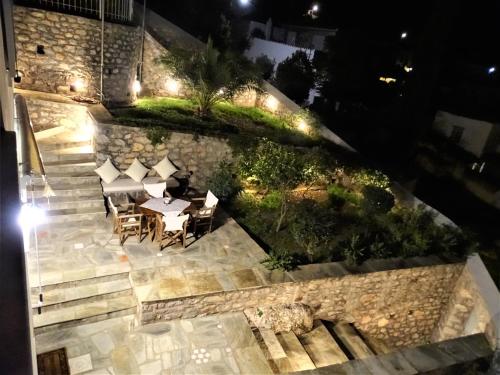 an overhead view of a patio with a table and chairs at Villa ADA in Hydra