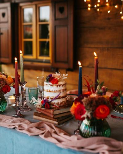a table with a cake and candles on it at Villa Botanica in Mirkovec