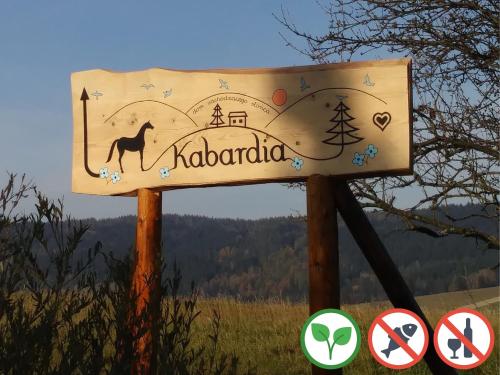 a sign with a camel and the wordhadaho on it at Osada Kabardia in Nowica