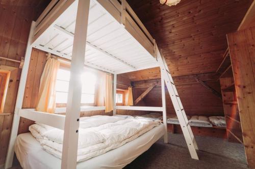Postel nebo postele na pokoji v ubytování Obere Maxlraineralm