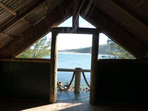 una vista dell'oceano da una stanza con finestra di Recanto Vó Terezinha a Imbituba