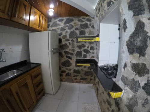 Kuchyň nebo kuchyňský kout v ubytování Pousada Residence Vila das Flores