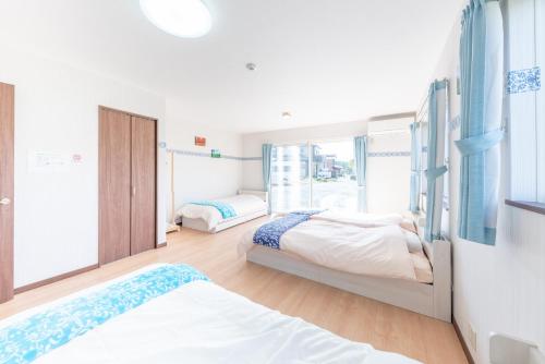 Ένα ή περισσότερα κρεβάτια σε δωμάτιο στο Private House Fuji