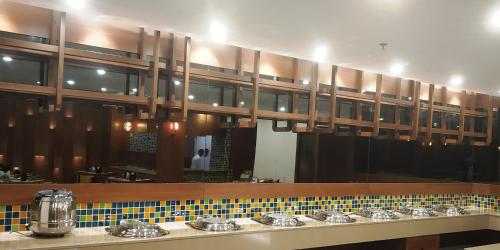 a bathroom with sinks and a large mirror at Hotel Shagun Chandigarh Zirakpur in Chandīgarh