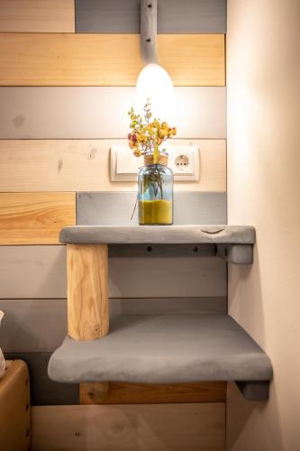 a vase of flowers on a shelf in a room at Cielo in Sierra Nevada