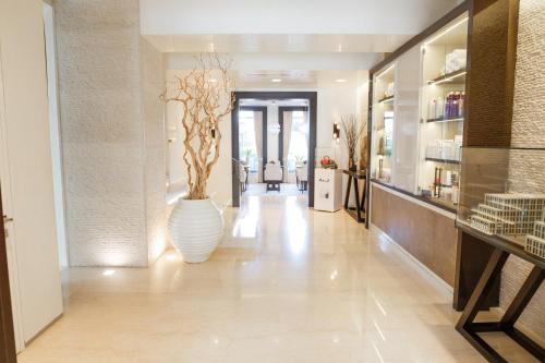 a hallway with a large white vase on the floor at SOHO boutique hotel in Dnipro