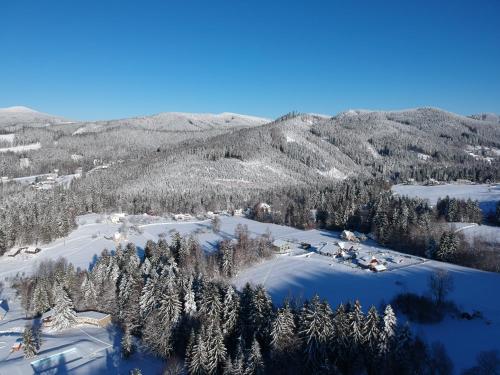 an aerial view of a ski resort in the snow at ENDEMIT Boutique Hotel & Spa in Horní Bečva