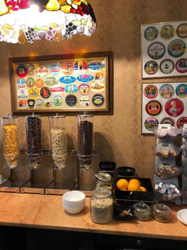 a counter with some food on a table at Hotel Aviator Boutique in Otopeni