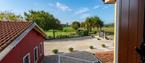 a view of a garden from a house at Agriturismo Paradiso in Sarego