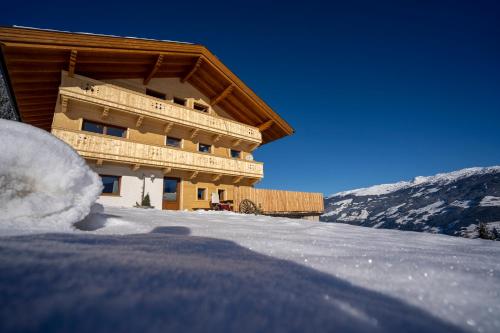 a building on top of a snow covered mountain at Klette in Hippach